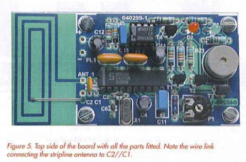 Figure 5. Top side of the board with all the parts fitted. Note the wire link connecting the stripline antenna to C2//C1. 
